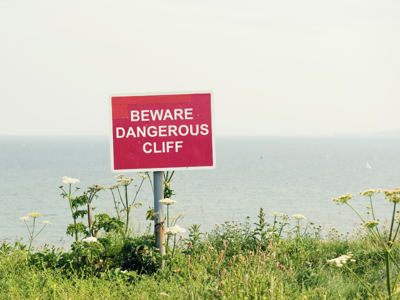 beware of cliff edge sign